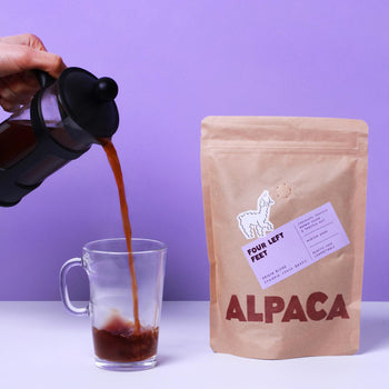 A pack of Alpaca Coffee with someone pouring coffee from a cafetiere