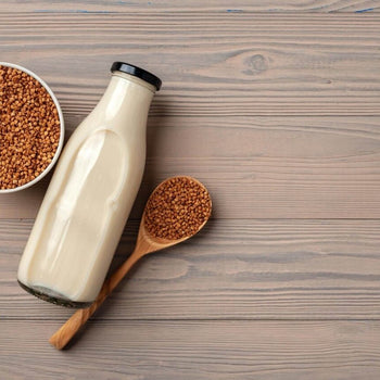 A glass bottle of milk on a table