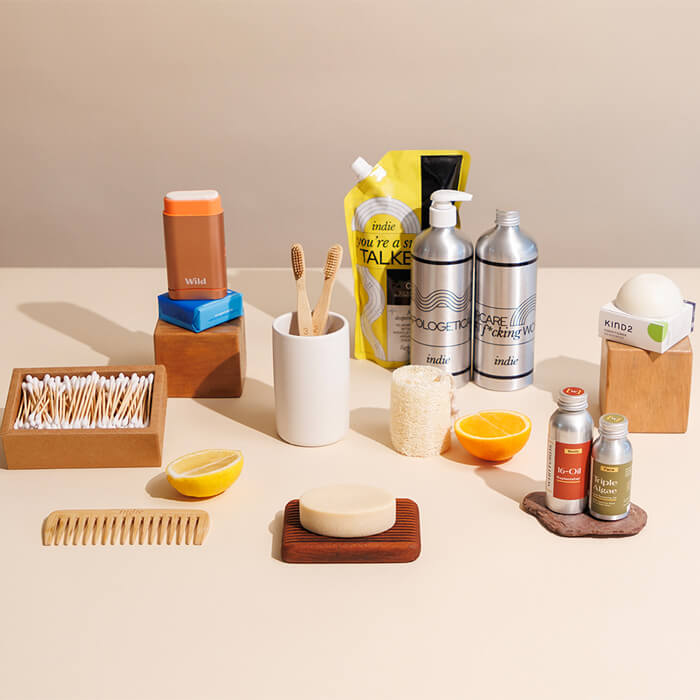 A group of beauty and skincare products on a beige background