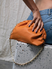 Under Her Eyes Norma Large Clutch, Shoulder & Cross Body Bag in Vintage Orange